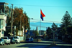 A rainbow flag on a pole.