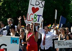 A group of people holding signs in a parade.
