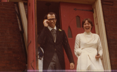 A man in a suit and a woman in a dress.