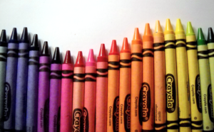 Colorful Crayola crayons arranged in a row.