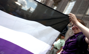 a person holding a flag and smiling